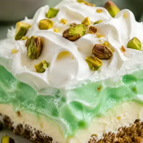 Close up Pistachio Lush with creamy layers and whipped topping